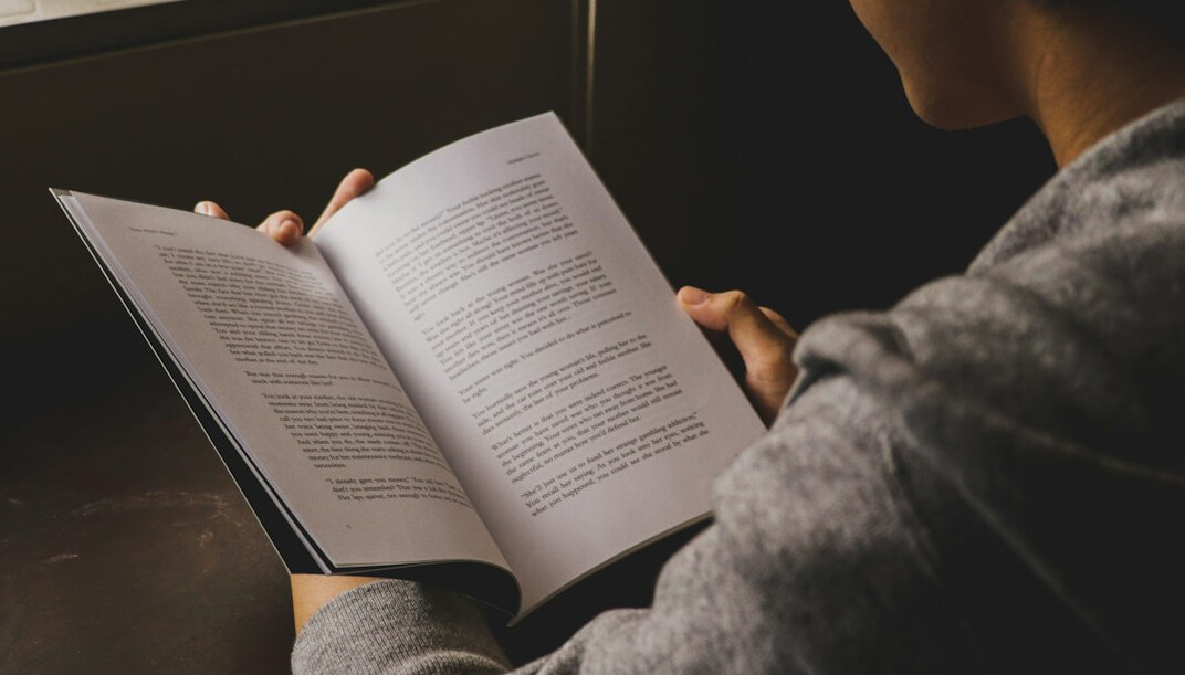 person reading self help book