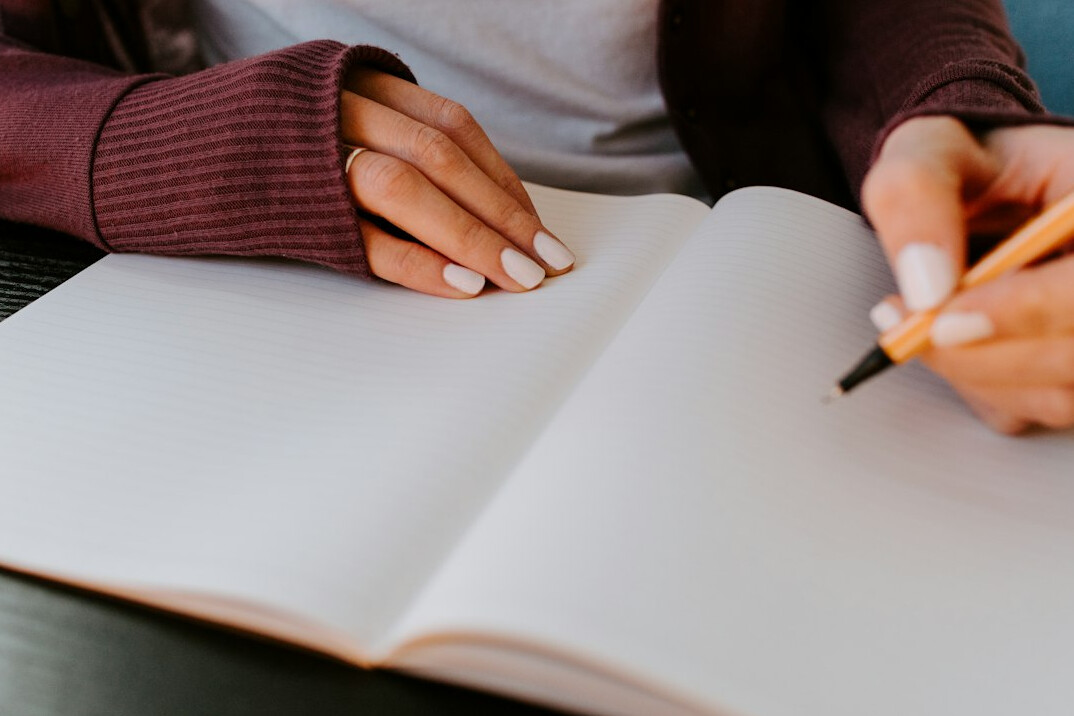 person journaling goals