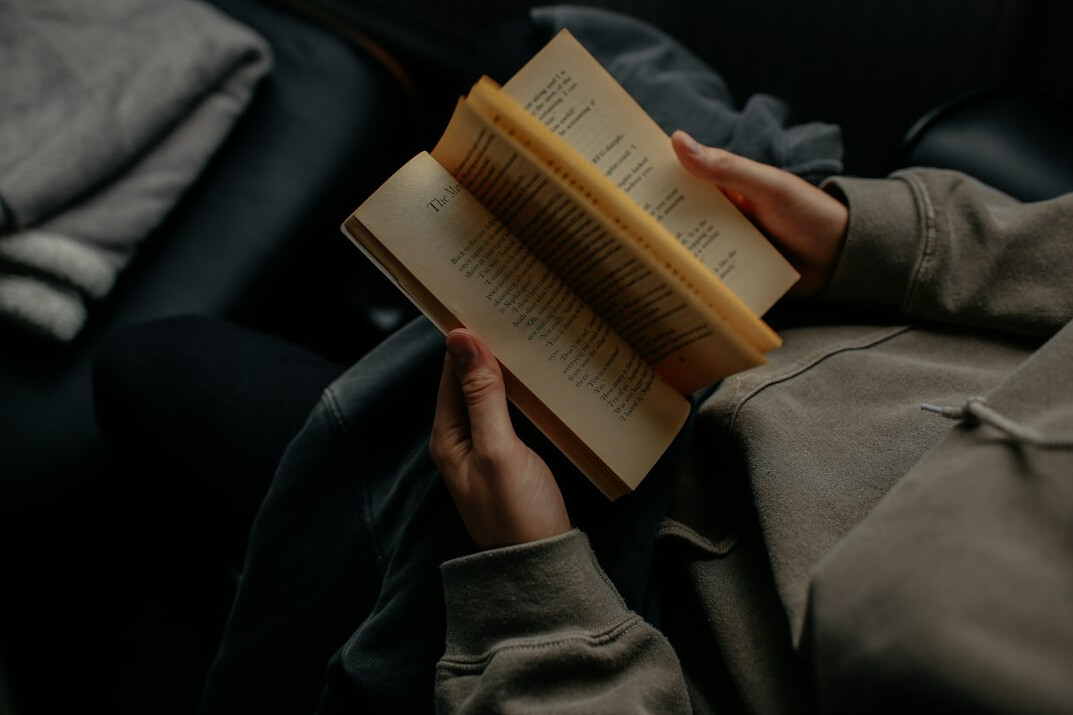 person reading self help book